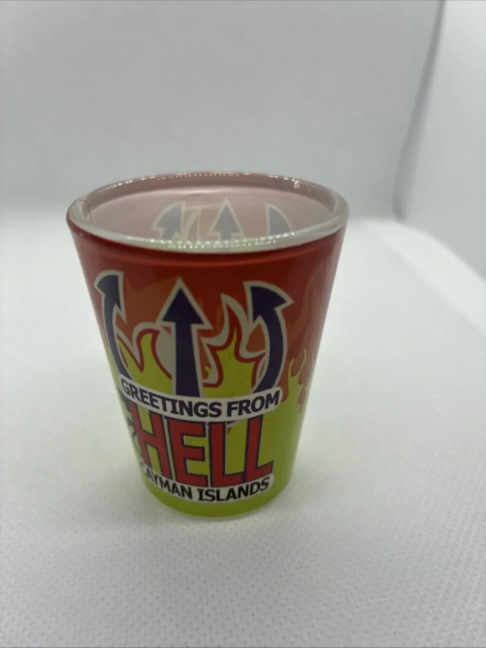 Vintage Greetings From Hell Cayman Islands Shot Glass Souvenir Red Green Flames